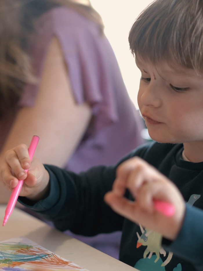 Photograph of a child drawing in MoLI.